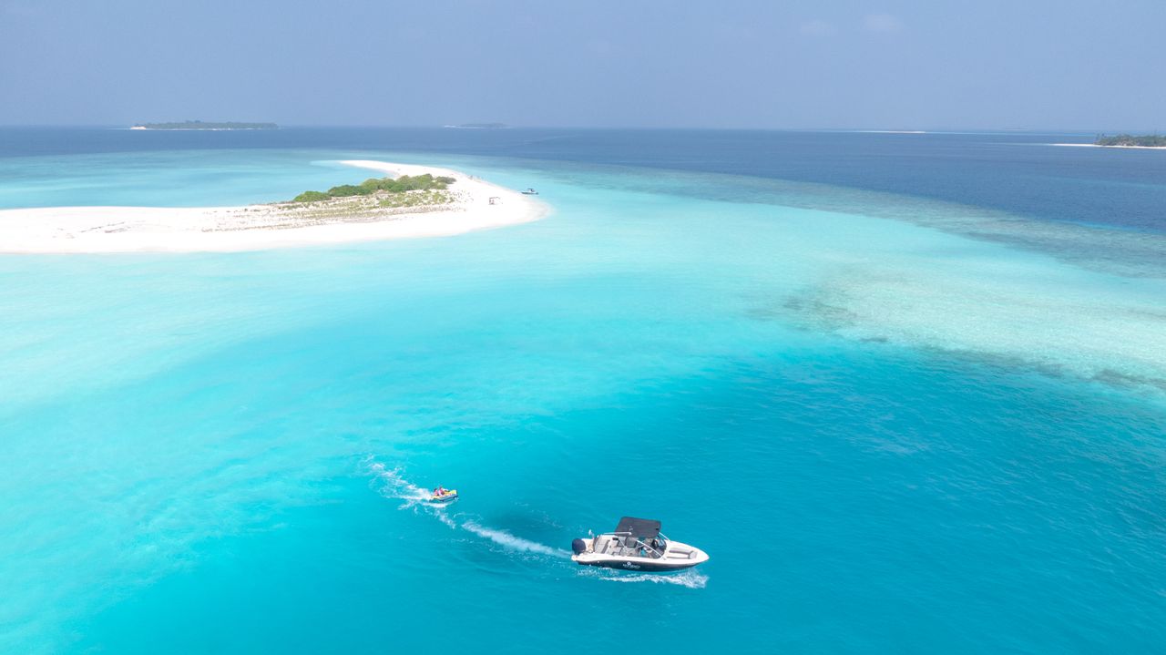 Contact Experience the stunning turquoise waters and pristine beaches of the Maldives from above.